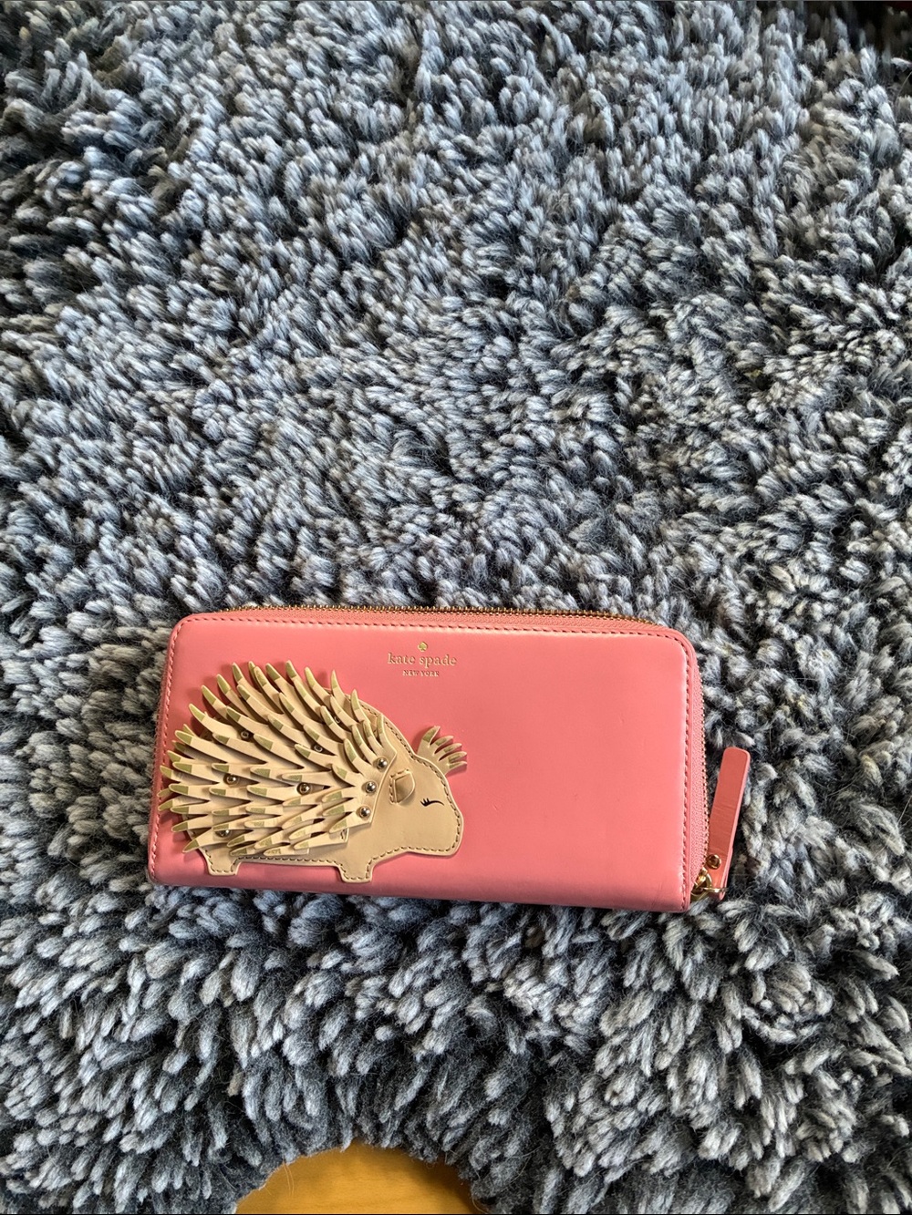 kate spade coral pink leather zip-around wallet with gold porcupine applique